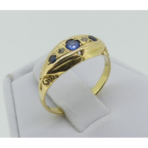 113 - A small sapphire and diamond boat shaped Ring, the small graduated sapphires with a diamond point be... 