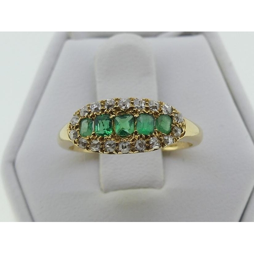 114 - An attractive emerald and diamond Ring, the centre set with five emeralds, with yellow gold tooling ... 