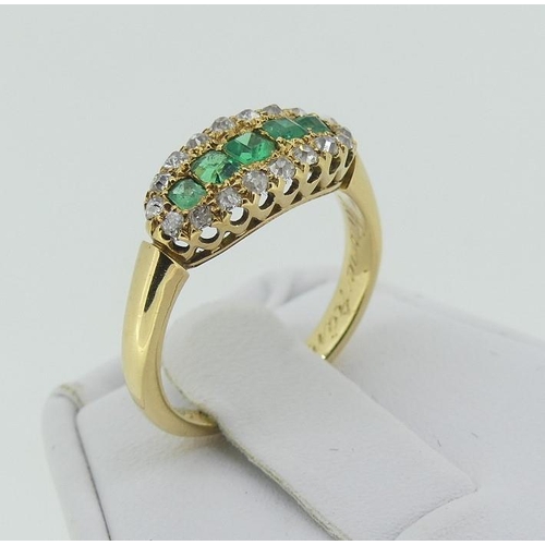 114 - An attractive emerald and diamond Ring, the centre set with five emeralds, with yellow gold tooling ... 