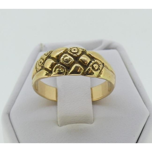 118 - A yellow gold Ring, with flared front engraved with flower heads, Size P, unmarked but tested as pro... 