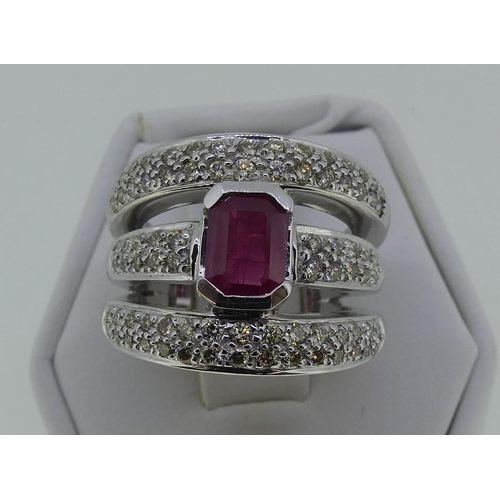 119 - A ruby and diamond Dress Ring, the flared front formed of three bands, all with pave-set diamonds, w... 