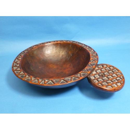 595 - A Tribal geometrically-carved wooden circular Bowl, with protruding circular handle (carved from sam... 