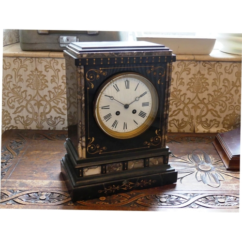 633 - A Victorian slate Mantel Clock, 13in (33cm) high x 10in (25.25cm) wide.