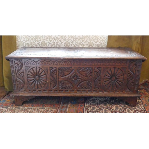 635 - An antique carved oak Coffer, 47in (119.5cm) wide x 17½in (44.5cm) deep x 19½in (49.5cm) high.