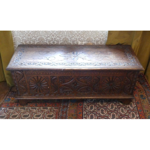 635 - An antique carved oak Coffer, 47in (119.5cm) wide x 17½in (44.5cm) deep x 19½in (49.5cm) high.