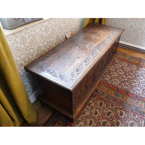 635 - An antique carved oak Coffer, 47in (119.5cm) wide x 17½in (44.5cm) deep x 19½in (49.5cm) high.