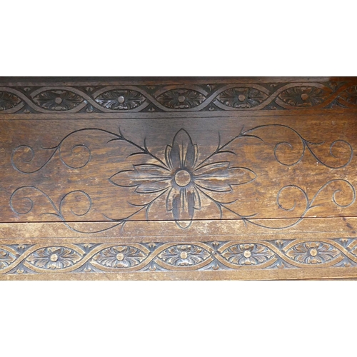 635 - An antique carved oak Coffer, 47in (119.5cm) wide x 17½in (44.5cm) deep x 19½in (49.5cm) high.