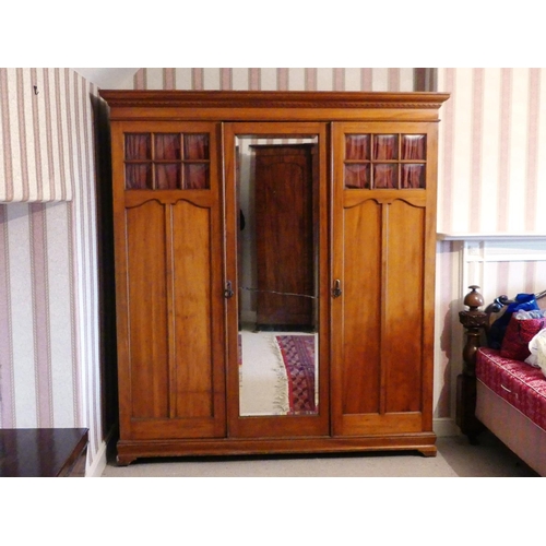 652 - A late Victorian mahogany Compactum Wardrobe, with glazed doors and central mirrored door, mirror cr... 