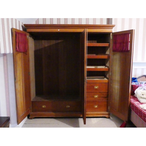 652 - A late Victorian mahogany Compactum Wardrobe, with glazed doors and central mirrored door, mirror cr... 