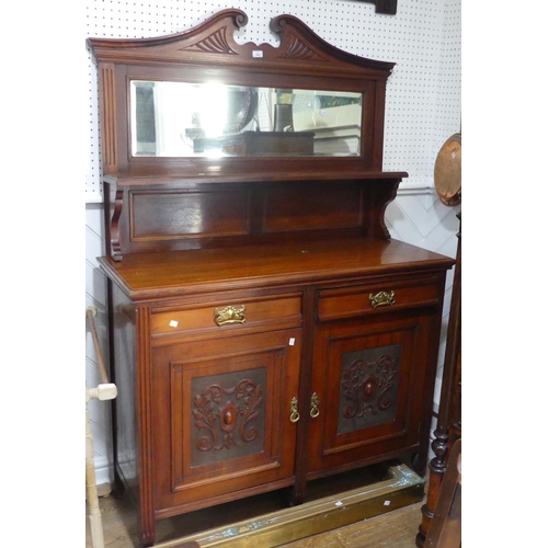 599 - An Edwardian mahogany mirrored-back Sideboard, the swan neck pediment above the bevelled edge rectan... 