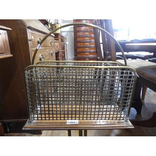 604 - An antique brass and mahogany Magazine Rack, the three brass and mesh dividers on mahogany board, ra... 