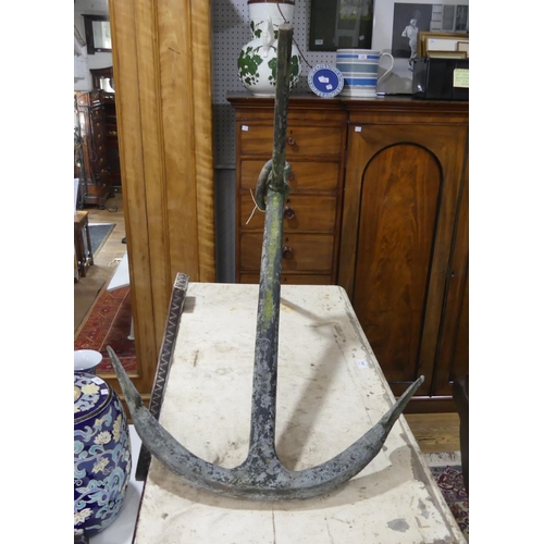 613 - A vintage iron Anchor, of traditional form, 32in (81cm) wide x 24in (61cm) deep x 36in (91cm) high.