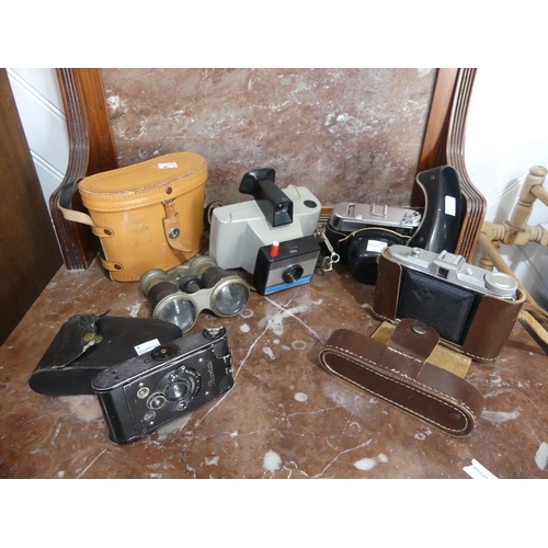 615 - Four vintage Cameras, including a Polaroid Singer II Land Camera, an Agfa Isolette and a Picolette, ... 