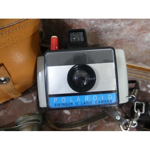 615 - Four vintage Cameras, including a Polaroid Singer II Land Camera, an Agfa Isolette and a Picolette, ... 