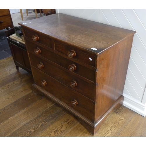 616 - A Georgian oak Chest of Drawers, the two short above three long graduated in size, with turned oak h... 