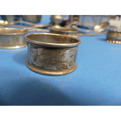 72 - Five various silver Napkin Rings, approx total weight 1.9ozt, all distorted in shape, initialled etc... 