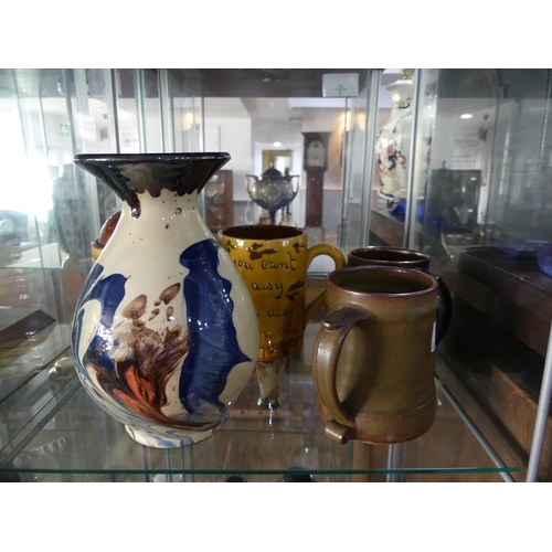 102 - A small quantity of Studio Pottery; comprising two Leach Pottery Tankards, one decorated with brown ... 