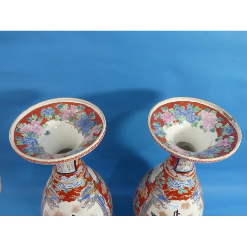 109 - A pair of Japanese imari Vases, of ovoid form with flared necks, decorated with figures and Chrysant... 