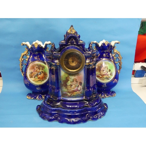 116 - A Victorian three-piece ceramic blue-ground Clock Garniture, with transfer decoration, comprising a ... 