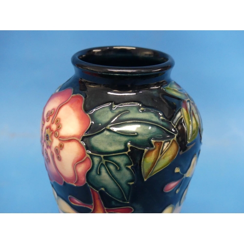 127 - A Moorcroft 'Oberon' pattern Baluster Vase, the tube-lined design with impressed marks to base, date... 