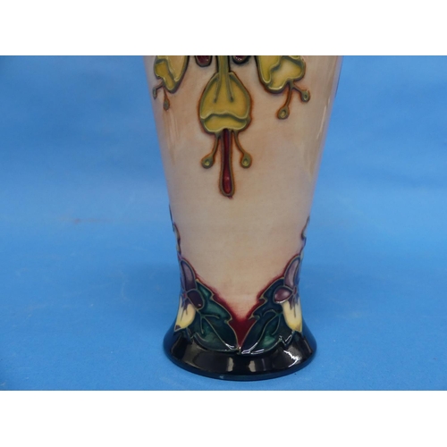 127 - A Moorcroft 'Oberon' pattern Baluster Vase, the tube-lined design with impressed marks to base, date... 