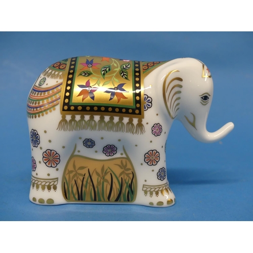 132 - A set of four Royal Crown Derby elephant Paperweights, comprising 'Raj' signature and colourway edit... 