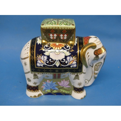 132 - A set of four Royal Crown Derby elephant Paperweights, comprising 'Raj' signature and colourway edit... 