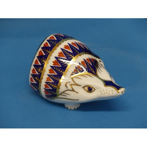 136 - A Royal Crown Derby Hedgehog Paperweight, decorated in imari palette with silver stopper to base, bo... 