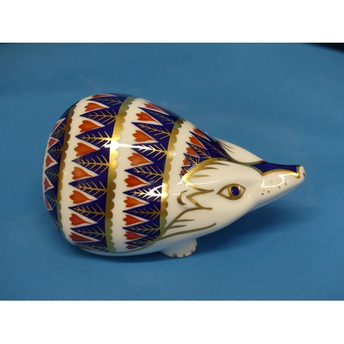 136 - A Royal Crown Derby Hedgehog Paperweight, decorated in imari palette with silver stopper to base, bo... 