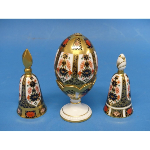 145 - A Royal Crown Derby 1128 pattern Egg on Stand, the egg and stand decorated in Old Imari pattern, wit... 