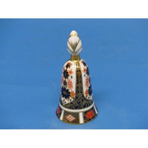 145 - A Royal Crown Derby 1128 pattern Egg on Stand, the egg and stand decorated in Old Imari pattern, wit... 