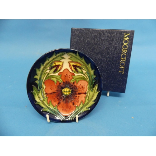 148 - A Moorcroft lily design Pin Dish, the tube-lined design with impressed factory marks, also stamped F... 