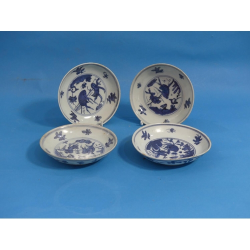 151 - A set of four antique oriental blue and white porcelain Saucer Dishes, painted with animals, square ... 