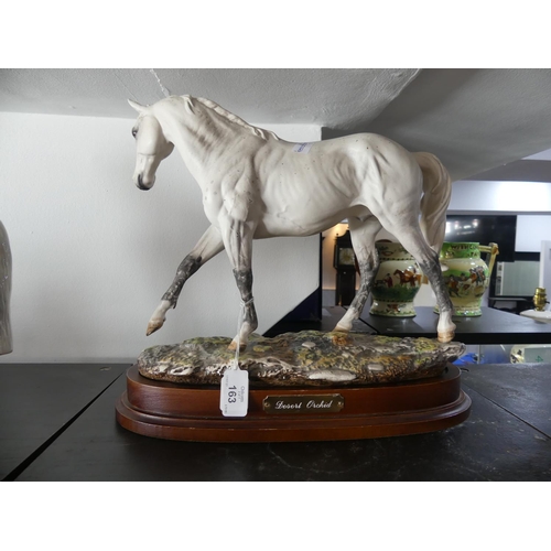 163 - A Royal Doulton limited edition figure of Desert Orchid, DA134, no.955 of 7500, on a wooden plinth, ... 