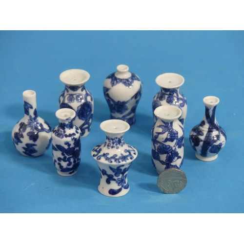 164 - Eight Chinese porcelain blue and white 'Doll's House' Miniature Vases, Qing dynasty, with floral dec... 