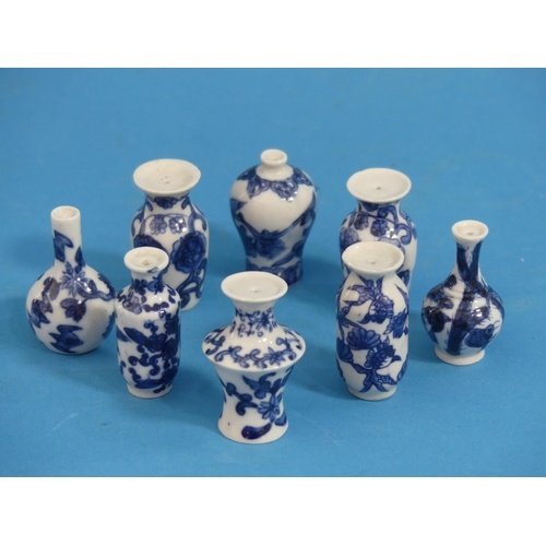 164 - Eight Chinese porcelain blue and white 'Doll's House' Miniature Vases, Qing dynasty, with floral dec... 