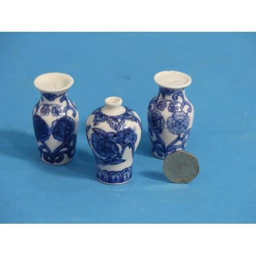 164 - Eight Chinese porcelain blue and white 'Doll's House' Miniature Vases, Qing dynasty, with floral dec... 