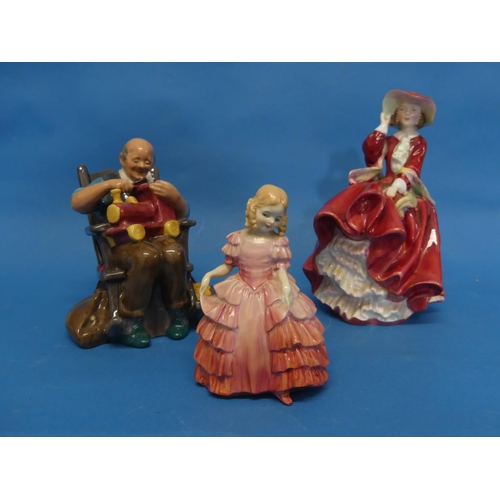 165 - A Royal Doulton 'The Toymaker' figurine, H.N.2250, 5½in (14cm) high, together with two other Royal D... 