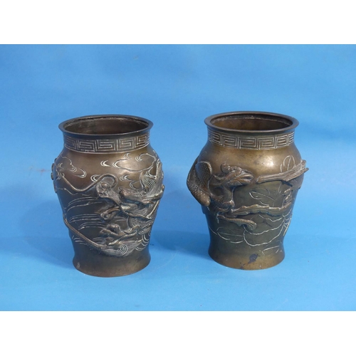 186 - A pair of late 19thC oriental bronze baluster Vases, each moulded in relief in the Japanese style wi... 