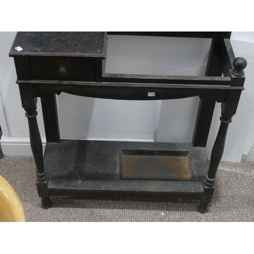 290 - An Edwardian oak Hall Stand, the rectangular bevel edged mirror with a half shelf below, small stora... 