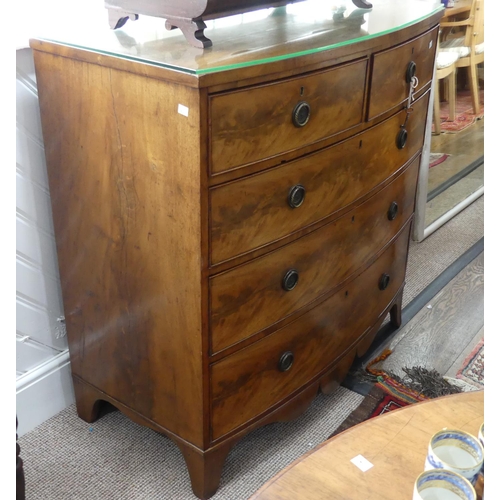 301 - A Victorian mahogany bow-front Chest of Drawers, with two short and three long drawers above shaped ... 