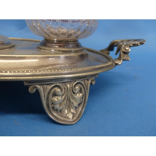 305 - A Victorian silver-plated and cut glass Inkstand, of oval form, the two ink pots flanking a taper ca... 