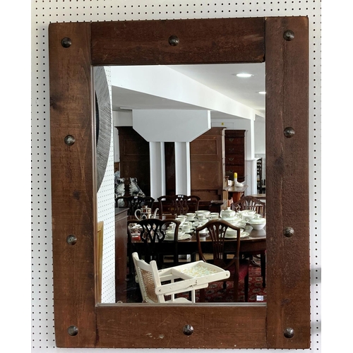 309 - A rustic-style oak rectangular wall Mirror, the large distressed oak frame interspersed with metal s... 