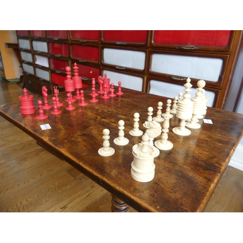 321 - A 19thC ivory Chess Set, with natural coloured and red stained pieces, King 4in (10cm) high, complet... 