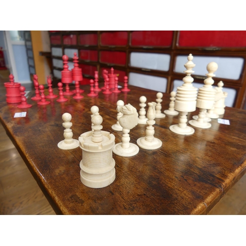 321 - A 19thC ivory Chess Set, with natural coloured and red stained pieces, King 4in (10cm) high, complet... 