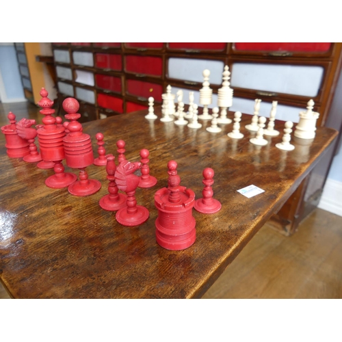 321 - A 19thC ivory Chess Set, with natural coloured and red stained pieces, King 4in (10cm) high, complet... 