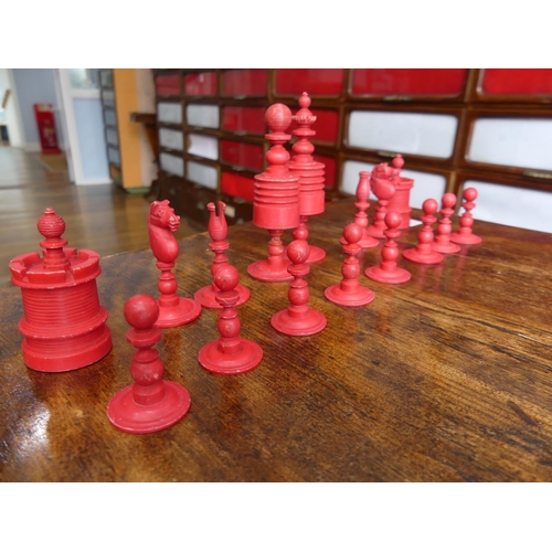 321 - A 19thC ivory Chess Set, with natural coloured and red stained pieces, King 4in (10cm) high, complet... 