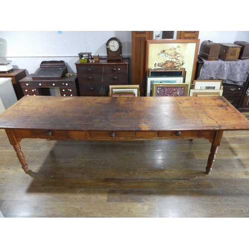 335 - A large early 20thC pine plank top Kitchen Table, with three frieze drawers, 124½in (316cm) long, 38... 