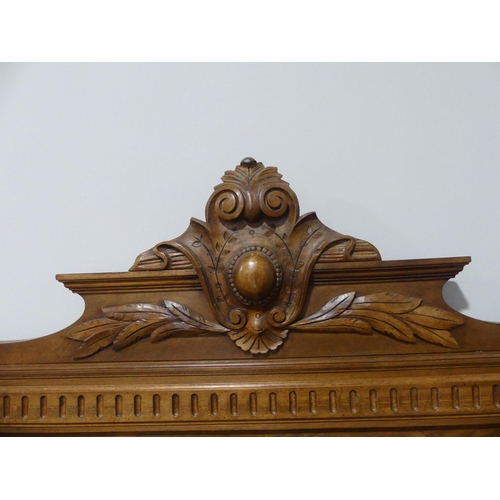 341 - An antique French carved walnut double Bedstead, the head and base boards with quarter-veneer detail... 