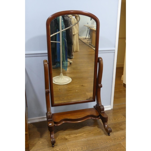 353 - A Victorian mahogany Cheval Mirror, the arched-top rectangular plate within a pivoting frame with sc... 